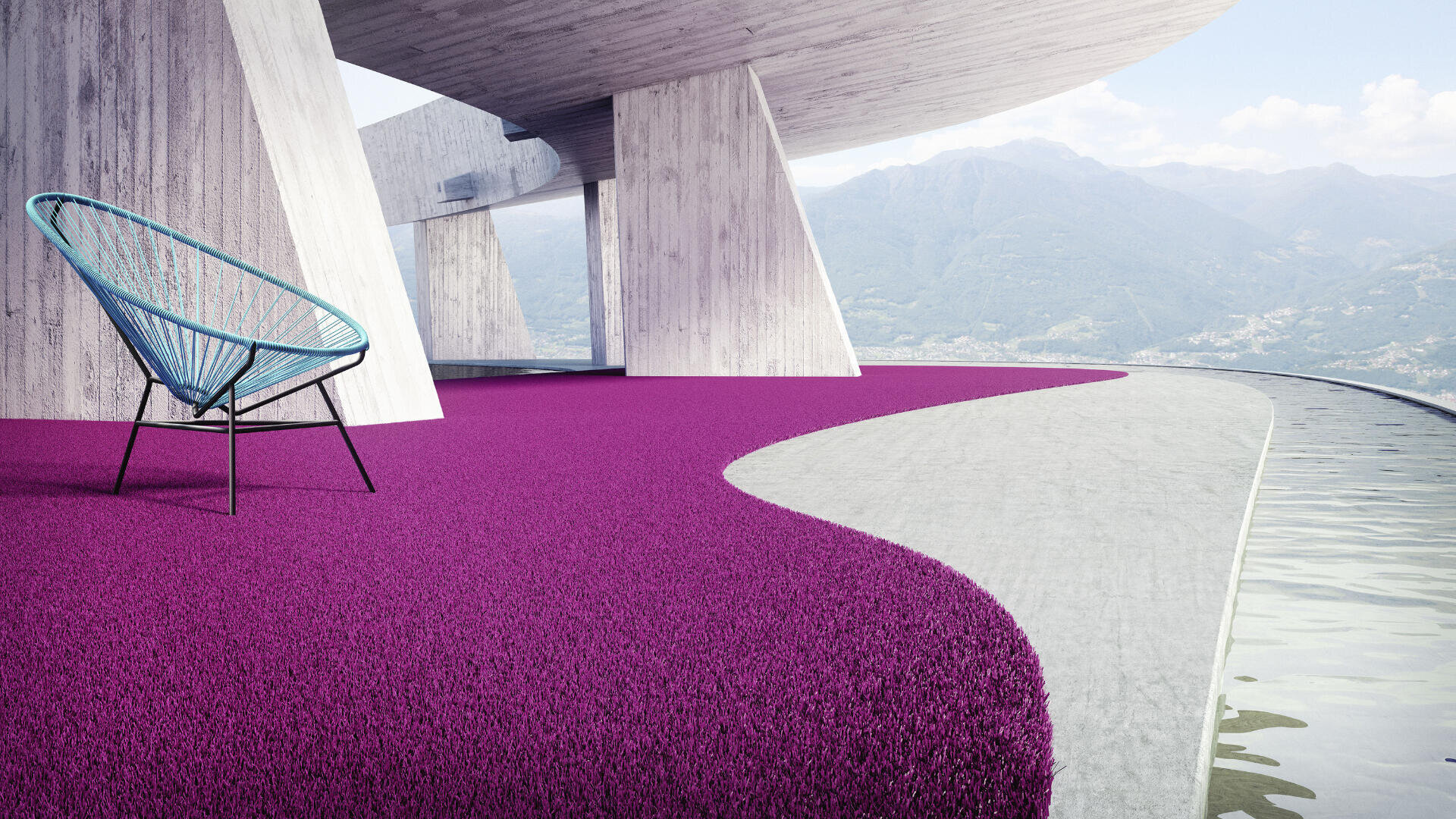 Eine moderne architektonische Terrasse mit einer geschwungenen Betonstruktur, einem leuchtend violetten Teppich, einem blauen Drahtsessel und einem flachen Wasserspiel, während im Hintergrund Berge und ein Tal zu sehen sind.