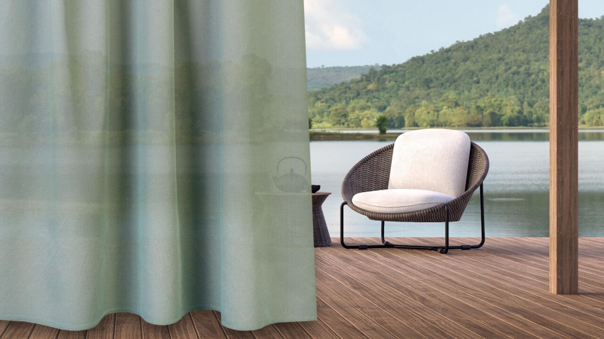 A cozy outdoor chair with a light cushion sits on a wooden deck by a calm lake, partially obscured by a sheer curtain, with green hills and trees in the background.