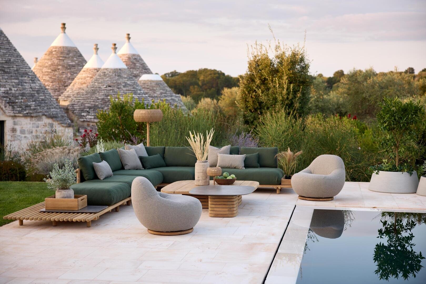 A terrace with a pool and a large sofa.