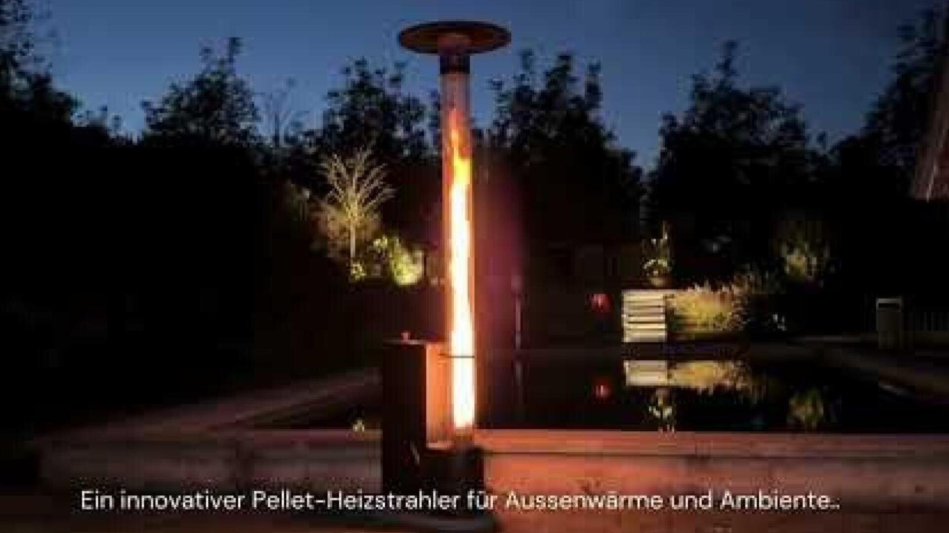 A tall outdoor pellet stove glows with a vertical flame next to a pool at night, surrounded by trees. The German text at the bottom reads: An innovative pellet heater for outdoor warmth and ambience...