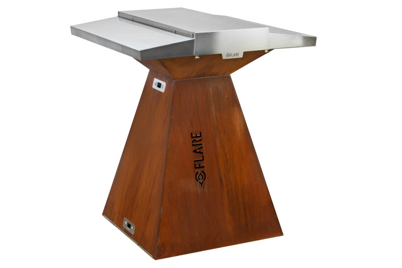 A modern barbecue for outdoor use with a stainless steel plate and a rust-colored, pyramid-shaped base with the inscription FLARE. The barbecue has a sleek, modern design with clean lines and metal surfaces.