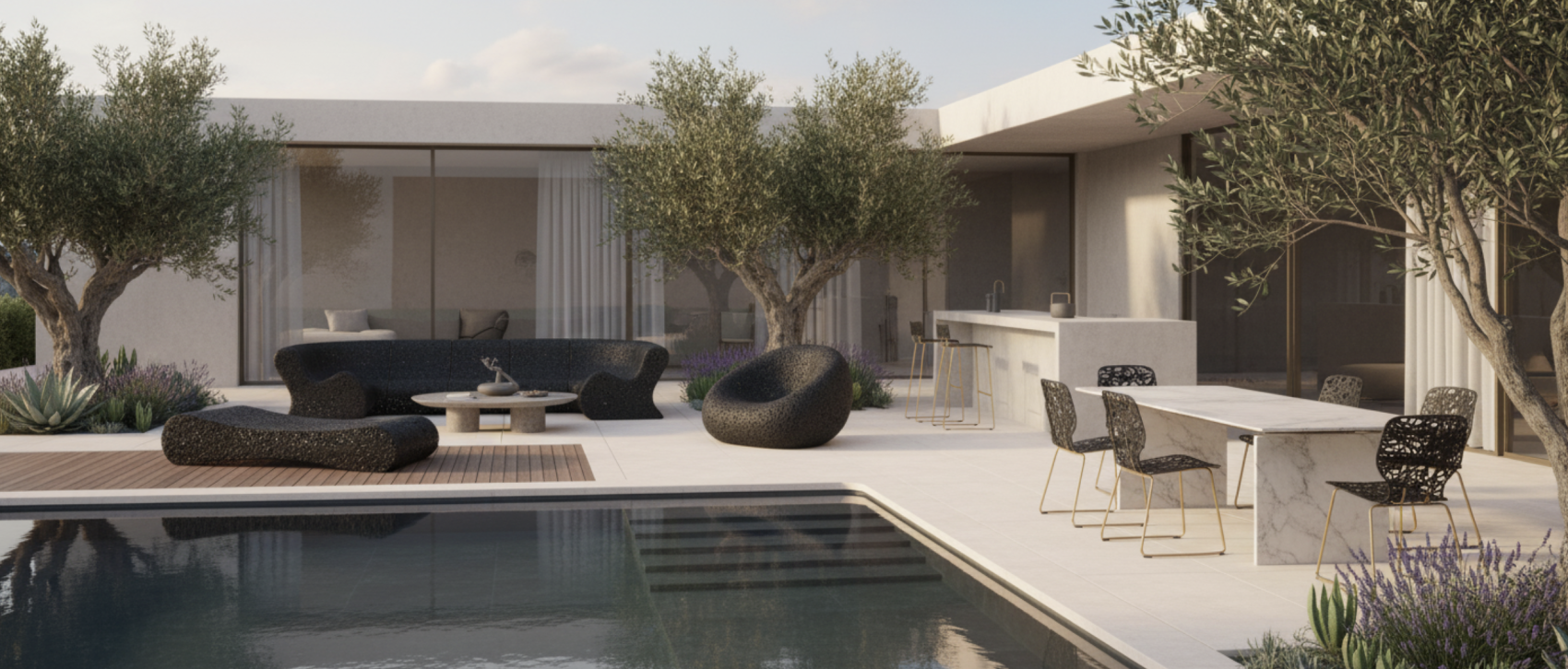 Modern outdoor patio with sleek black lounge furniture, marble dining table, and bar seating beside a swimming pool, surrounded by olive trees and contemporary architecture under soft daylight.